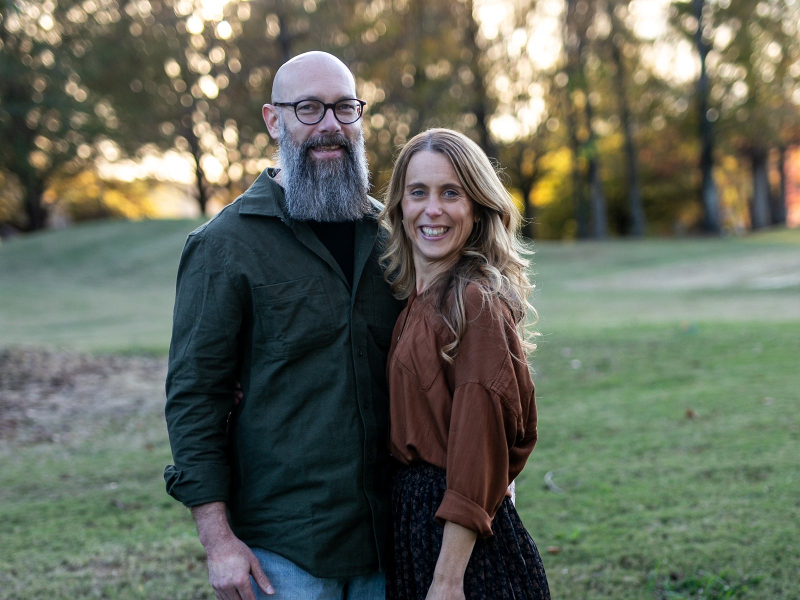 Zach and Stacey, the founders of Soothe, standing together outdoors in autumn light